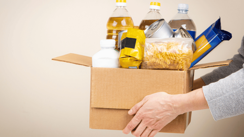 person handing out food to the needy in palm coast, florida