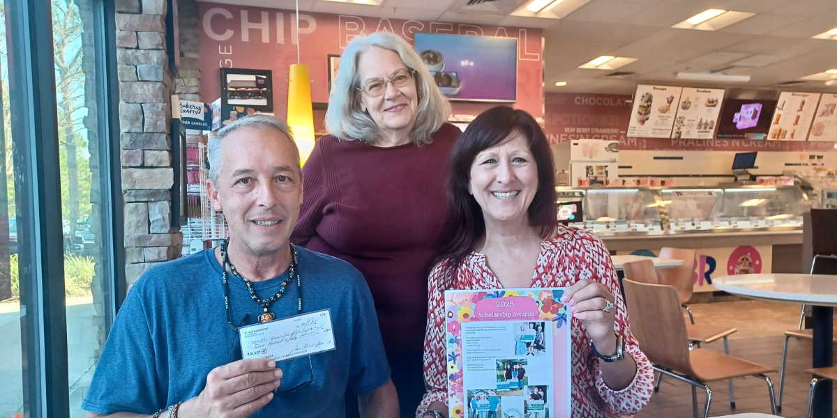 Photograph featuring, from left to right, Stephan Curcio, Kenetha Kilmurray, and Denise Garcia during a private scholarship donation meeting for The Garden Club at Palm Coast. Stephan Curcio is holding a $750 donation check while Kenetha Killmurray and Denise Garcia represent the organization’s leadership. The meeting highlights community-driven philanthropy supporting local kids and graduating students through educational scholarships, environmental career pathways, camps, classes, and essential learning resources funded by The Garden Club at Palm Coast.