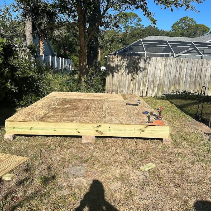 Raised deck for outdoor shed